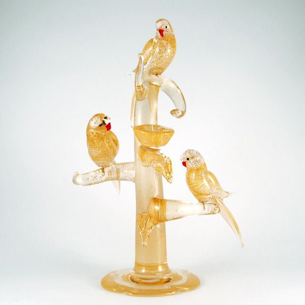 Murano glass birds in gold on a tree with nests