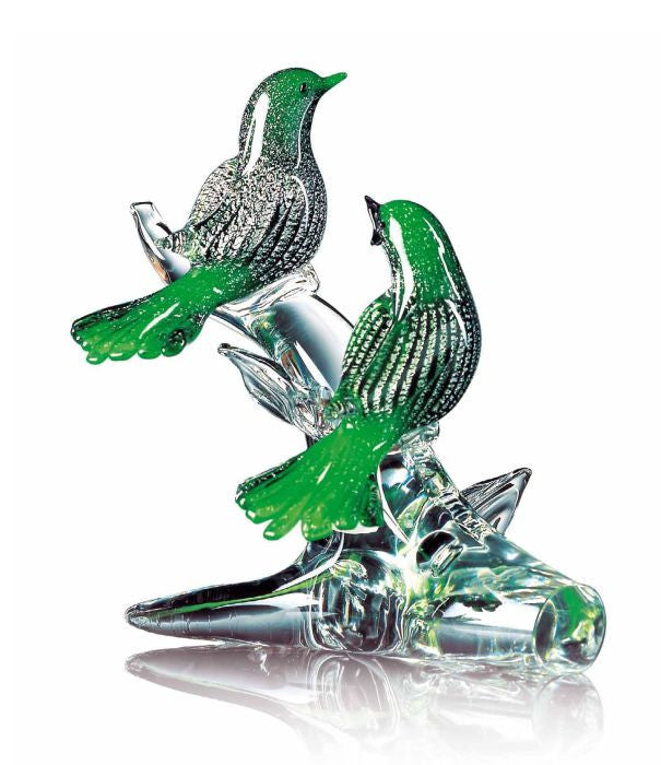 Green murano glass birds on a low branch